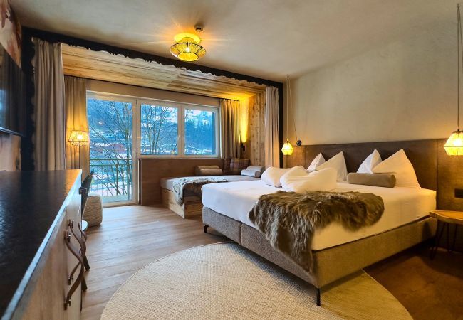 Aparthotel in Kaprun - Kamer met  tweepersoonsbed en slaapbank